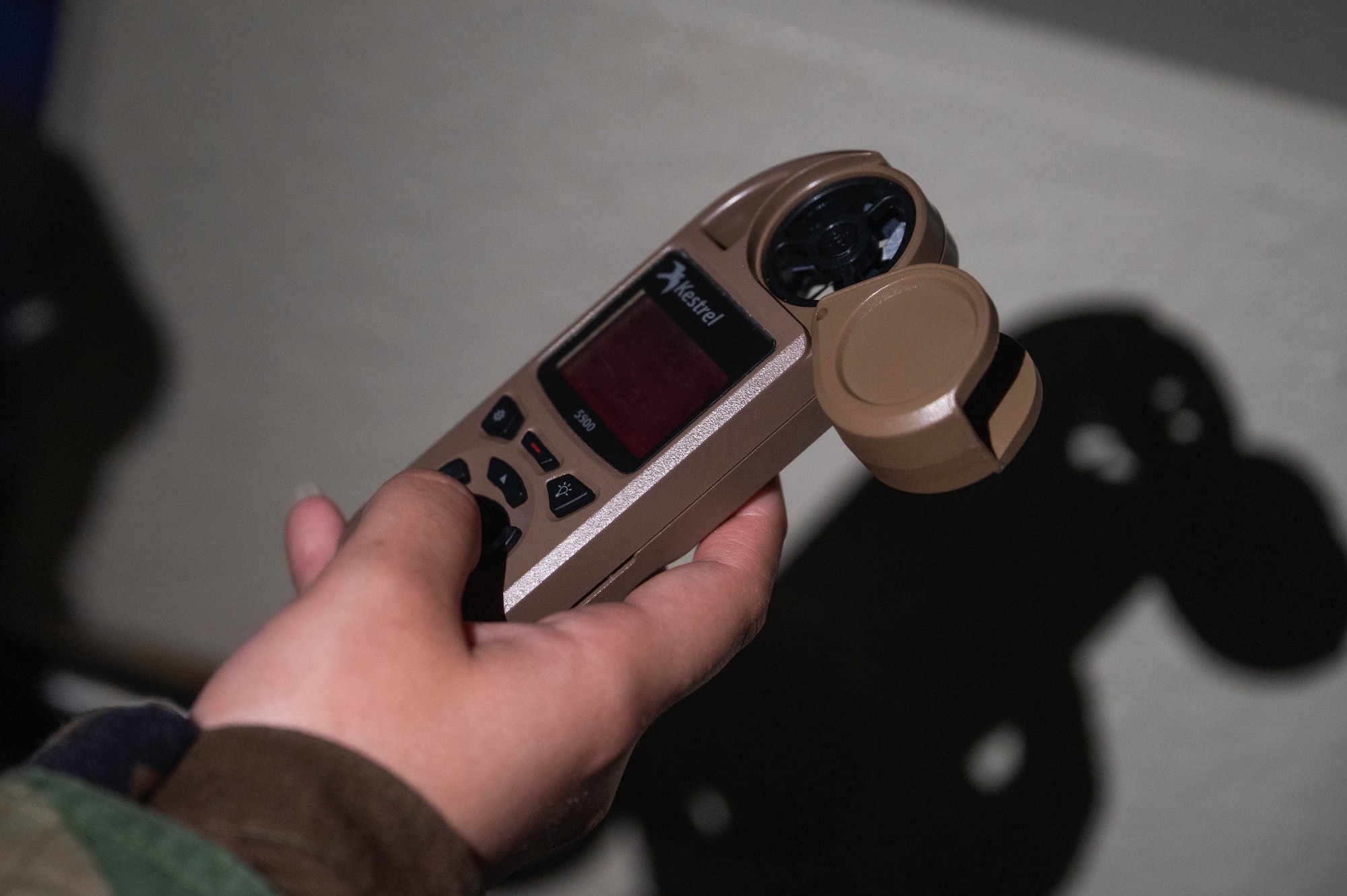 U.S. Air Force Senior Airman Vivian Ceniceros, 18th Operations Support Squadron weather forecaster, reads weather data on a handheld device during a USAF-led operational exercise Beverly Midnight 26 at Kadena Air Base, Japan, March 12, 2026. BM26 enhances resiliency and survivability across all levels by providing Airmen the opportunity to practice lifesaving skills, strengthening defense capabilities in support of regional security. (U.S. Air Force photo by Senior Airman Jamal Berry II)