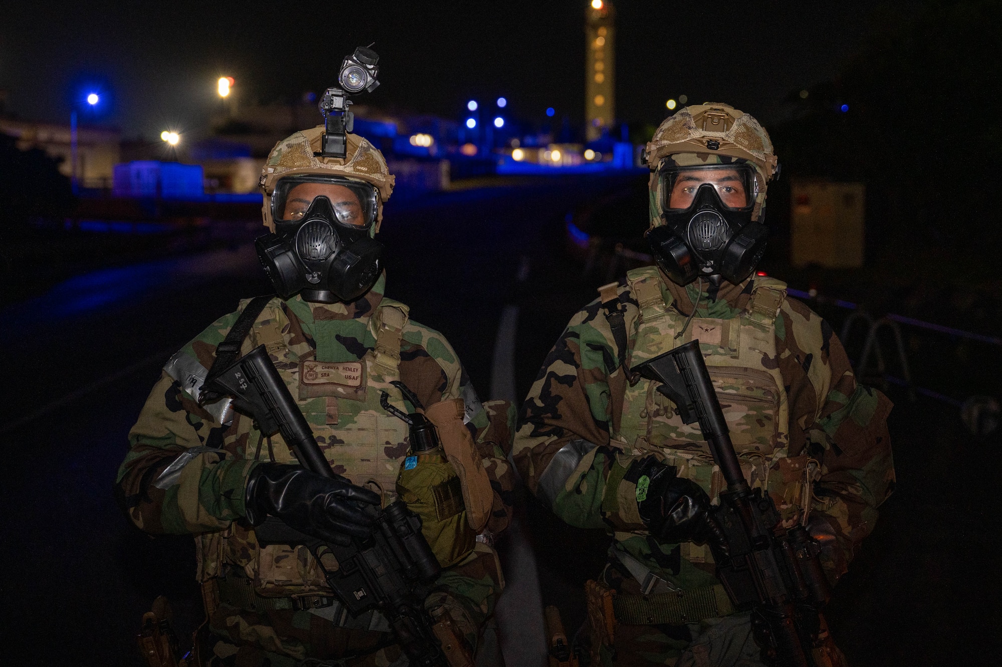 U.S. Air Force Senior Airman Chenya Henley, left, 18th Security Forces Squadron law enforcement patrolman, and Airman Trey Brown, response force member, pose for a photo during a USAF-led operational exercise Beverly Midnight 26 at Kadena Air Base, Japan, March 12, 2026. BM26 provides an opportunity for U.S forces across Japan to train for real-world contingencies, strengthening coordination, readiness and regional defense capabilities. (U.S. Air Force photo by Airman 1st Class Nathaniel Jackson)