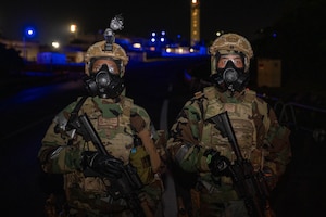 U.S. Air Force Senior Airman Chenya Henley, left, 18th Security Forces Squadron law enforcement patrolman, and Airman Trey Brown, response force member, pose for a photo during a USAF-led operational exercise Beverly Midnight 26 at Kadena Air Base, Japan, March 12, 2026. BM26 provides an opportunity for U.S forces across Japan to train for real-world contingencies, strengthening coordination, readiness and regional defense capabilities. (U.S. Air Force photo by Airman 1st Class Nathaniel Jackson)