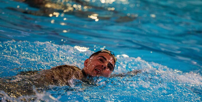 U.S. Marine Corps 2nd Lt. Slade A. Merk, a student with The Basic School, conducts water rescue swims during the Water Survival Advanced Course at Ramer Hall on Marine Corps Base Quantico, Virginia, Jan. 22, 2026. The week-long Water Survival Advanced course challenges Marines’ physical and mental limits through aquatic endurance training, including long swims, breath holds, and complex rescue drills vital to amphibious operations. (U.S. Marine Corps photo by Lance Cpl. Donovan E. Melendez)