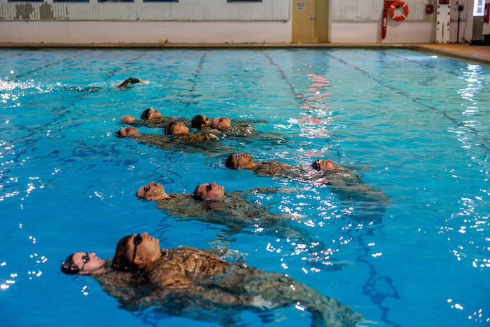 U.S. Marines perform water rescue swims during the Water Survival Advanced Course at Ramer Hall on Marine Corps Base Quantico, Virginia, Jan. 22, 2026. The week-long Water Survival Advanced course challenges Marines’ physical and mental limits through aquatic endurance training, including long swims, breath holds, and complex rescue drills vital to amphibious operations. (U.S. Marine Corps photo by Lance Cpl. Donovan E. Melendez)