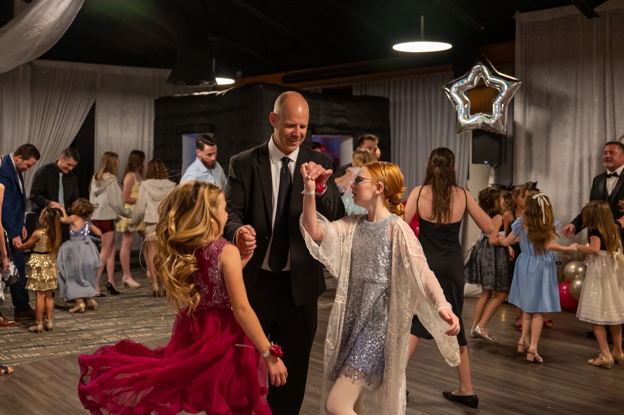 The Space Launch Delta 45 Chaplain’s Office hosted its annual Daddy-Daughter Dance on February 27, 2026. Approximately 80 parents and daughters attended the event, giving service members an opportunity to step away from launch operations and spend dedicated time with their children. (U.S. Space Force Photo by DeAnna Murano)