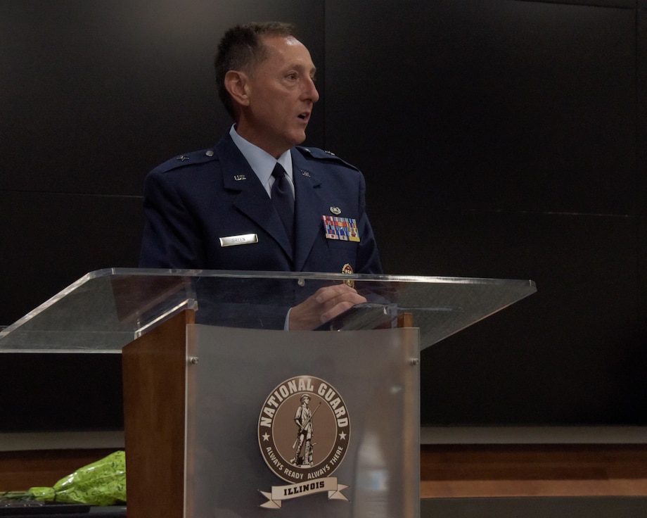 Brigadier General John M. (Marty) Green speaks from a podium shortly after being promoted June 20, 2023.