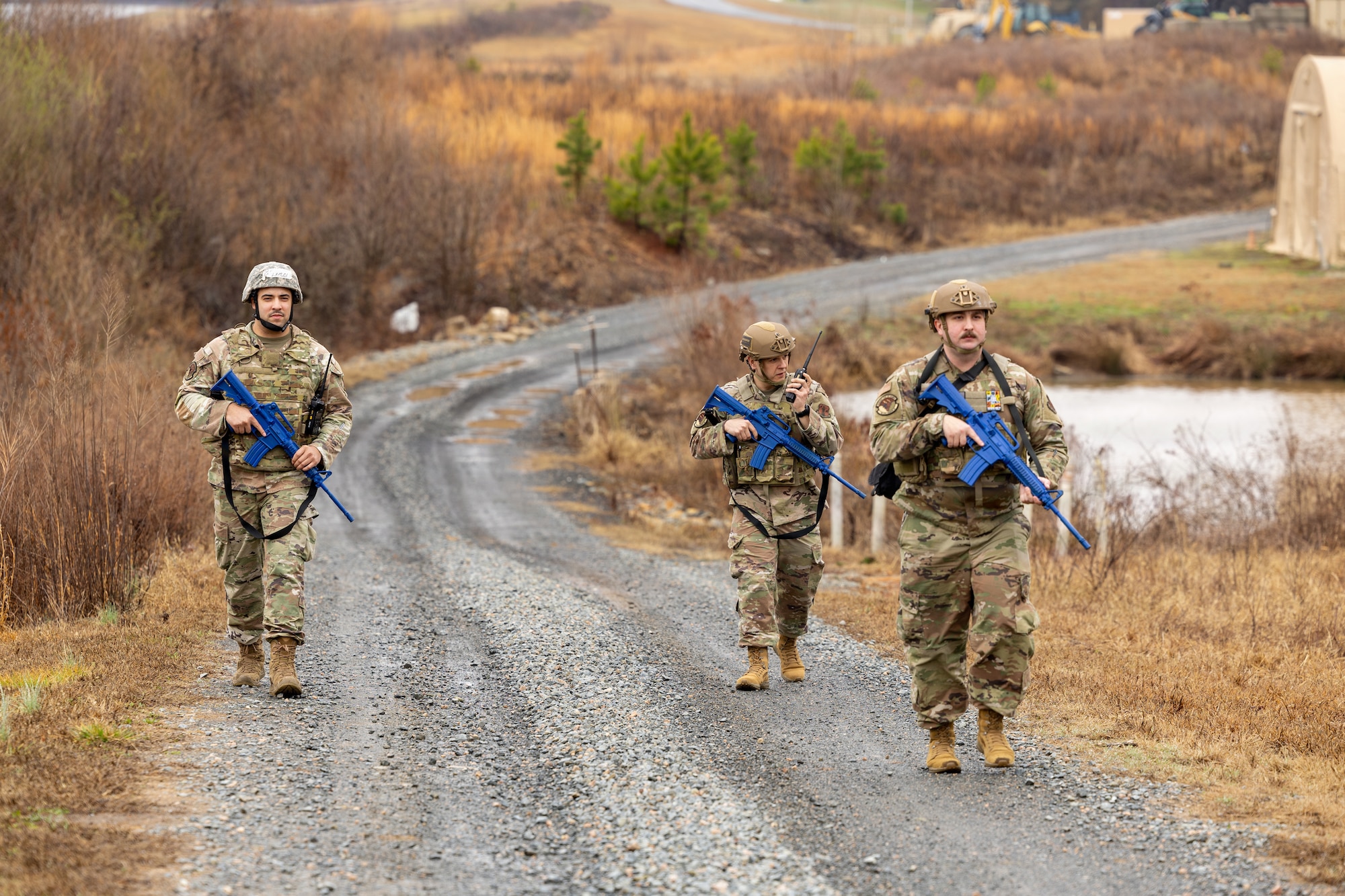 U.S. Airmen assigned to the 145th Civil Engineer Squadron patrol toward a reported suspicious individual during Prime Base Engineer Emergency Force (BEEF) week 2026 at the Regional Training Site, New London, N.C., Feb. 23-27, 2026.