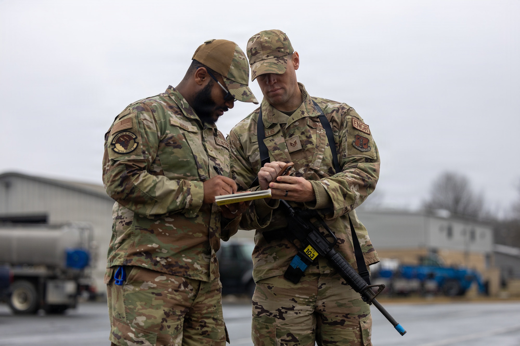 U.S. Air Force Airman 1st Class Abdu M. Abdu, 145th Civil Engineer Squadron (CES), engineering assistant, left, and Staff Sgt. Patrick H. Mullis, 145th CES, engineering assistant, annotate the airfield damage during Prime Base Engineer Emergency Force (BEEF) week 2026 at the Regional Training Site, New London, N.C., Feb. 23-27, 2026.