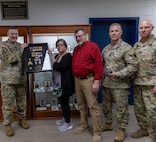 Brig. Gen. Lenny Williams, Assistant Adjutant General – Army and Commander of the Illinois Army National Guard, presents Sue King-Wieczorek, Gold Star mother of U.S. Army Sgt. Robert M. Weinger, with a shadow box containing Weinger’s medals he earned during his military service in the Illinois Army National Guard.