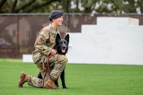 Maxwell Air Force Base military working dog handler poses with their military working dog.