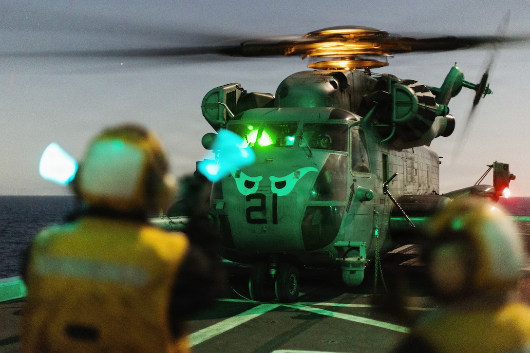 A U.S. Marine Corps CH-53E Super Stallion with Marine Medium Tiltrotor Squadron (VMM) 163 (Reinforced),11th Marine Expeditionary Unit, stages on the flight deck of San Antonio-class amphibious transport dock ship USS Portland (LPD 27) during an amphibious assault in the Pacific Ocean, March 2, 2026. The 11th MEU is currently underway aboard the Boxer Amphibious Ready Group in the U.S. 3rd Fleet area of operations conducting integrated training that enhances lethality and warfighting readiness. (U.S. Marine Corps photo by Sgt. Joseph Helms)