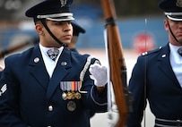 U.S. Air Force Senior Airman Wijeury Collado, ceremonial guardsman with the U.S. Air Force Honor Guard Drill Team, performs a routine during a visit to Campbell High School in Smyrna, Ga., March 11, 2026. The team performed a four-man drill that showcased precision, excellence and discipline to an audience of approximately 300 students and faculty members and encouraged students to pursue opportunities in the Air Force. (U.S. Air Force photo by Tech. Sgt. Sergio A. Gamboa)