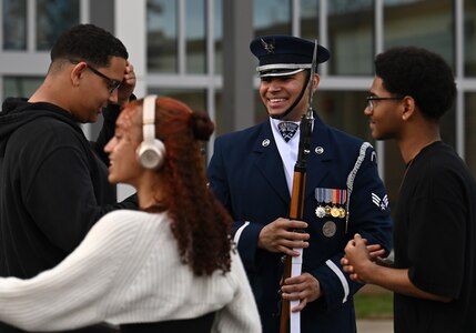 U.S. Air Force Senior Airman Wijeury Collado, ceremonial guardsman with the U.S. Air Force Honor Guard Drill Team, talks with Junior Reserve Officers’ Training Corps cadets during a visit to Campbell High School in Smyrna, Ga., March 11, 2026. The team performed a four-man drill that showcased precision, excellence and discipline to an audience of approximately 300 students and faculty members and encouraged students to pursue opportunities in the Air Force. (U.S. Air Force photo by Tech. Sgt. Sergio A. Gamboa)
