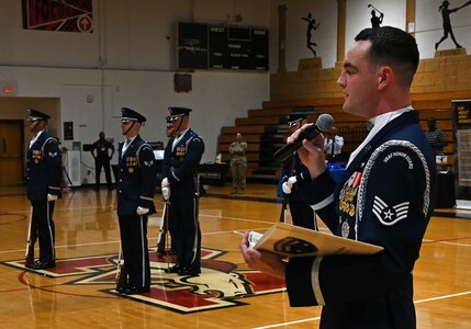 U.S. Air Force Staff Sgt. William Douglas, ceremonial guardsman with the U.S. Air Force Honor Guard Drill Team, emcees a performance during a visit to Ronald McNair Sr. High School in Atlanta, Ga., March 11, 2026. During the event, the Drill Team worked with local recruiters and high schools to emphasize the Air Force mission and inspire the future generation of service members. (U.S. Air Force photo by Tech. Sgt. Sergio A. Gamboa)