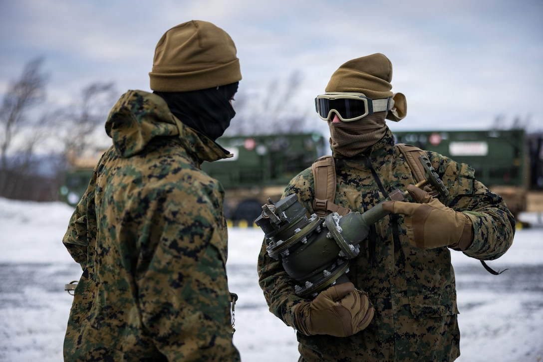 U.S. Marine Corps Cpl. Armand Brodeur, right, and Lance Cpl. Kwadier Young, both expeditionary fuels technicians with 6th Engineer Support Battalion, 4th Marine Logistics Group, Marine Forces Reserve, inspect a four-inch gate valve in Elvegårdsmoen, Norway, Feb. 26, 2026. The Marines were organizing their bulk fuel equipment in preparation for exercise Cold Response 26. A key component of NATO's enhanced vigilance activity Arctic Sentry, exercise Cold Response 26 is a Norwegian-led winter military exercise designed to enhance collective defense capabilities and ensure U.S. readiness to rapidly deploy and seamlessly operate alongside NATO Allies in challenging arctic conditions. (U.S. Marine Corps photo by Staff Sgt. Scott Jenkins)
