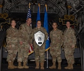 Leadership present a plaque to distinguished guest speaker, Lt. Gen. Linda Hurry, commander of Air Force Materiel Command, during the 5th Annual Knucklebuster Awards ceremony.