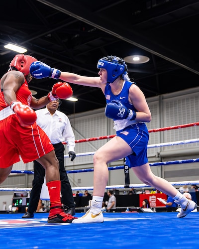 U.S. Air Force Airman 1st Class Randi Griffith, 91st Missile Security Operation Squadron (91 MSOS) tactical response force (TRF) member throws a punch during a USA Boxing match on Sept 18, 2025. As a member of 91 MSOS TRF Griffith applies the same split-second decision making, situational awareness and endurance required in the boxing ring to high-risk security operations.