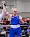 U.S. Air Force Airman 1st Class Randi Griffith, 91st Missile Security Operation Squadron tactical response force (TRF) member, raises her hand in victory during a USA Boxing match on Sept. 18, 2025. The conditioning and composure developed in the ring directly translates to her role as a TRF member.