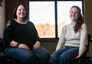Two SAPR representatives sitting in chairs posed for the camera.