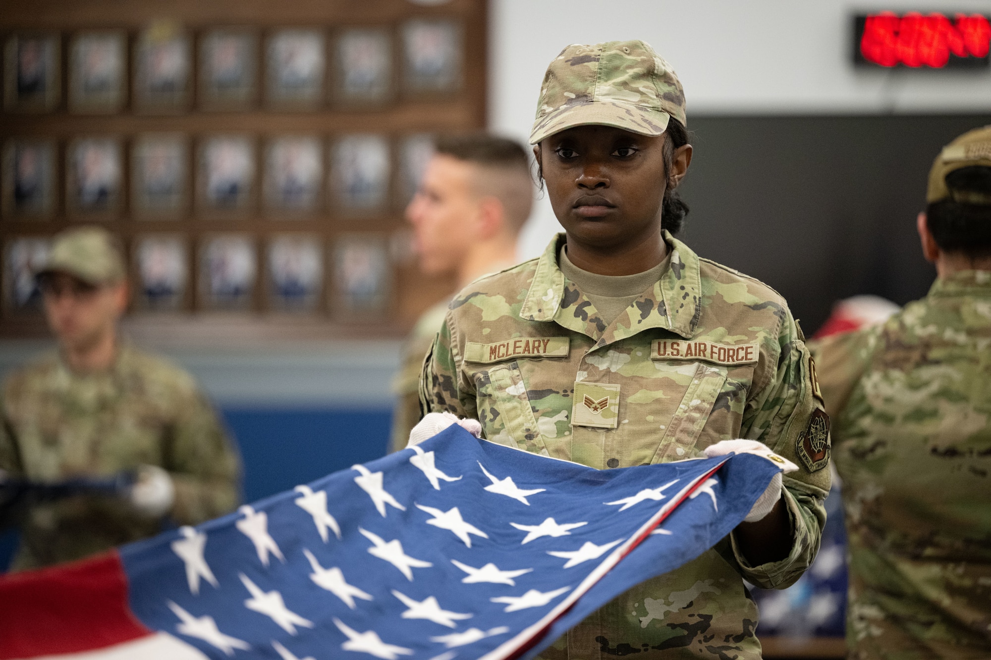 U.S. Air Force Senior Airman Tori McLeary, 436th Comptroller Squadron financial analyst, learns flag folding during a two-week Honor Guard initial training at Dover AFB, Delaware, Feb. 11, 2026. In addition to her work in finance and the many hours she puts in volunteering, McLeary recently joined the DAFB Honor Guard, hoping to achieve Honor Guard Member of the Year. (U.S. Air Force photo by Airman 1st Class Liberty Kuhn)