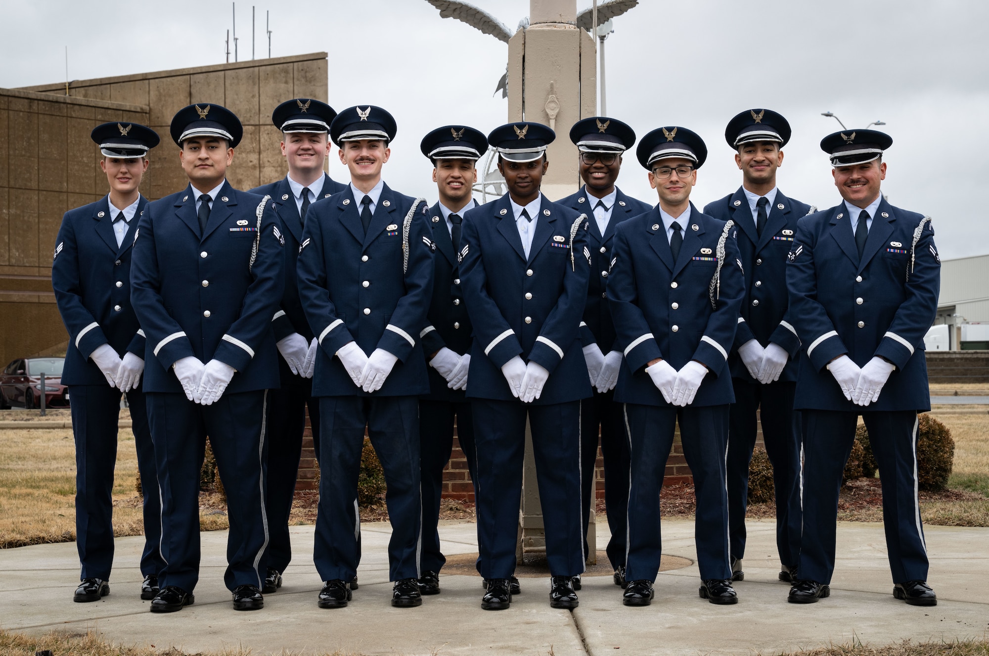 U.S. Air Force Senior Airman Tori McLeary, 436th Comptroller Squadron financial analyst, poses for a photo with the members of her Honor Guard flight at Dover Air Force Base, Delaware, Feb. 20, 2026. After a two-week initial training, McLeary graduated with her classmates as the newest member of DAFB Honor Guard. (U.S. Air Force photo by Airman 1st Class Liberty Kuhn)