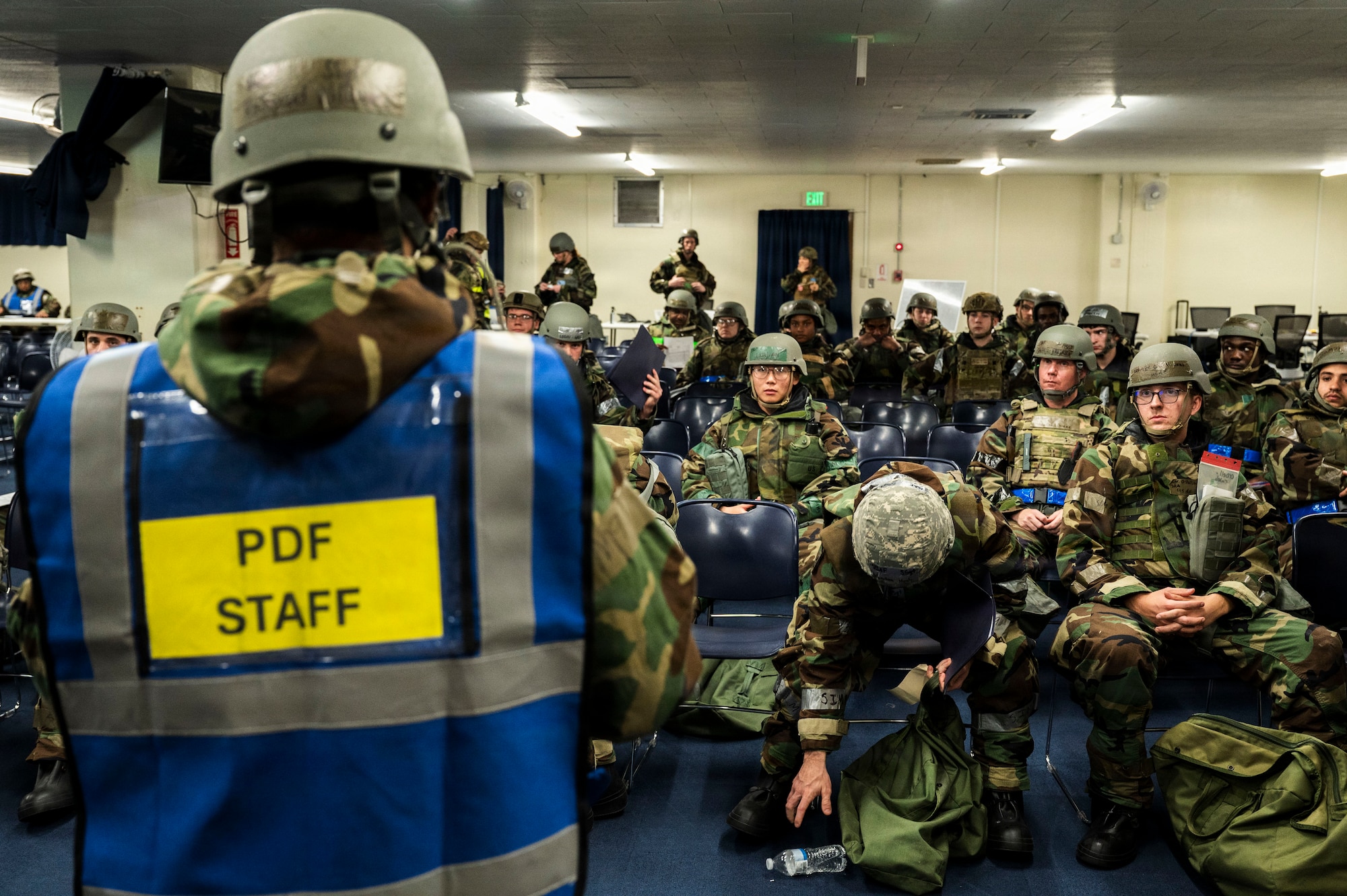 U.S. Air Force Staff Sgt. Rashaud Williams, 718th Force Support Squadron personnel deployment function lead, takes accountability of Airmen ahead of a simulated personnel deployment line during U.S. Air Force-led operational exercise Beverly Midnight 26 at Kadena Air Base, Japan, March 11, 2026.