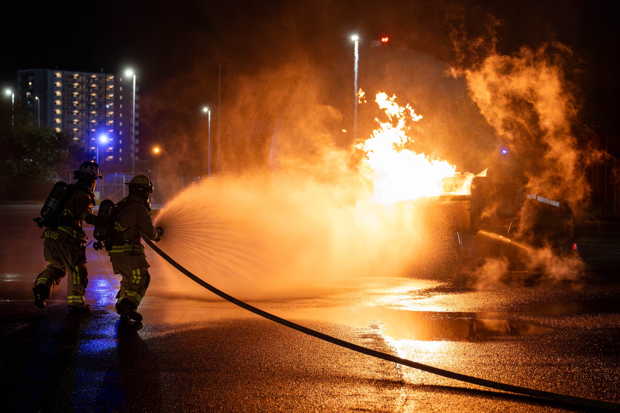 U.S. Air Force 18th Civil Engineer Squadron firefighters extinguish a simulated aircraft fire, during U.S. Air Force-led operational exercise, Beverly Midnight 26 at Kadena Air Base, Japan, March 12, 2026. BM26 enhances U.S. interoperability by fostering an exchange of information and refining shared tactics, techniques and procedures to better integrate defense capabilities in support of regional security. (Photo by U.S. Air Force Airman 1st Class Nathaniel Jackson)