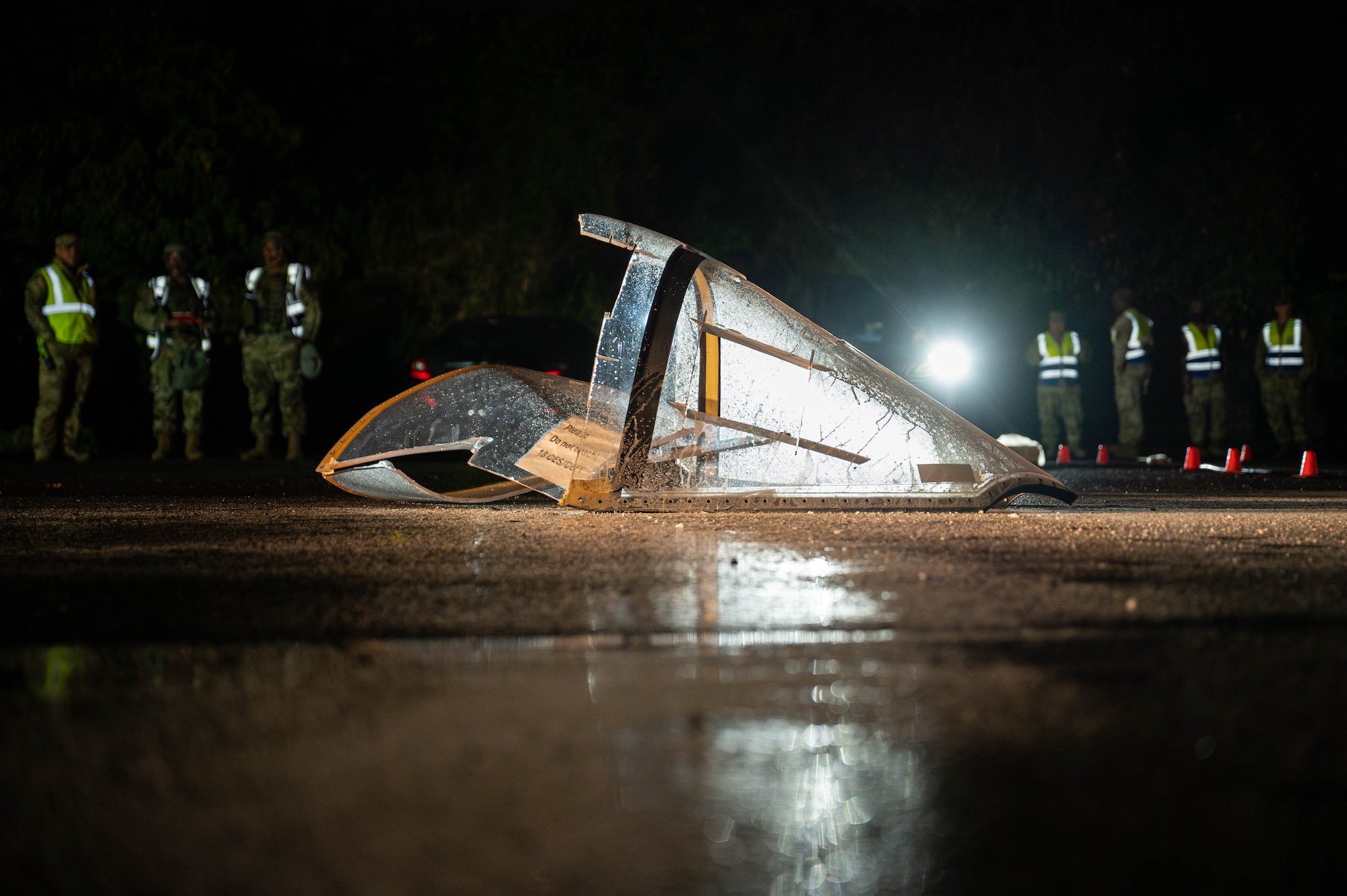 U.S. Air Force 18th Civil Engineer Squadron firefighters hose down a simulated aircraft on fire, during U.S. Air Force-led operational exercise, Beverly Midnight 26 at Kadena Air Base, Japan, March 12, 2026. This exercise tested rapid response capabilities to prepare our firefighters for potential emergencies in the Indo-Pacific region. (Photo by U.S. Air Force Airman 1st Class Nathaniel Jackson)