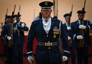 U.S. Air Force Capt. Andrew Paquin, ceremonial operations officer in charge of the U.S. Air Force Honor Guard Drill team, stands at attention during a performance at Ronald McNair Sr. High School in Atlanta, Ga., March 11, 2026. The Drill Team showcased the Air Force’s readiness and excellence, which they do through more than 100 performances a year worldwide, including major sporting events, international military tattoos, community festivals and school events. (U.S. Air Force photo by Tech. Sgt. Sergio A. Gamboa)