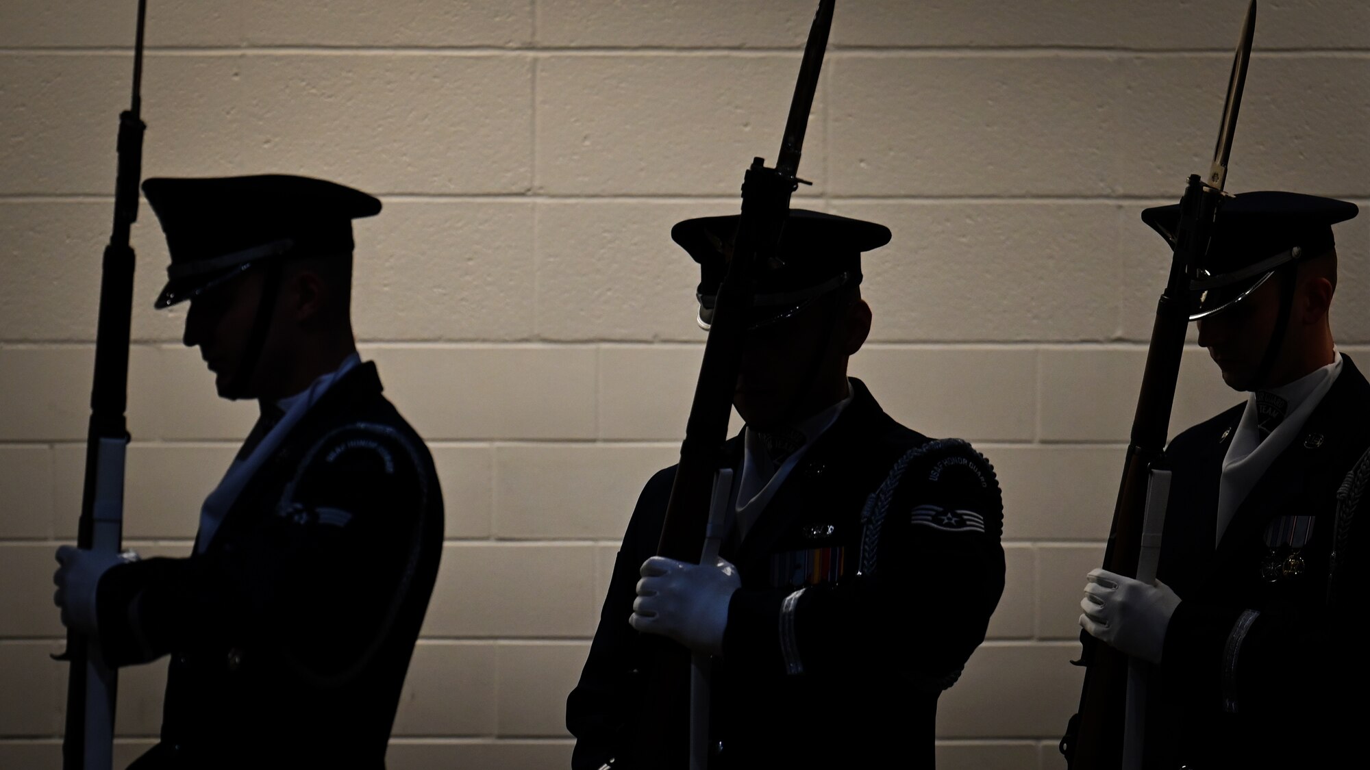 U.S. Air Force Honor Guard Drill Team ceremonial guardsmen walk through a gym tunnel for a performance during a visit to Ronald McNair Sr. High School in Atlanta, Ga., March 11, 2026. The Drill Team showcased the Air Force’s readiness and excellence, which they do through more than 100 performances a year worldwide, including major sporting events, international military tattoos, community festivals and school events. (U.S. Air Force photo by Tech. Sgt. Sergio A. Gamboa)