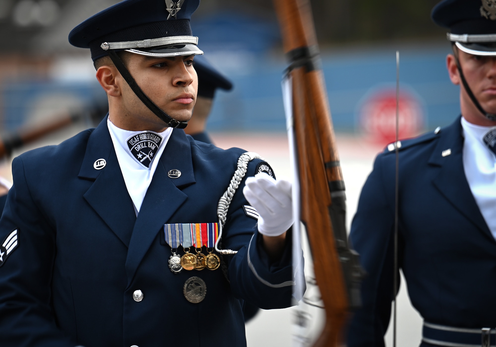 U.S. Air Force Senior Airman Wijeury Collado, ceremonial guardsman with the U.S. Air Force Honor Guard Drill Team, performs a routine during a visit to Campbell High School in Smyrna, Ga., March 11, 2026. The team performed a four-man drill that showcased precision, excellence and discipline to an audience of approximately 300 students and faculty members and encouraged students to pursue opportunities in the Air Force. (U.S. Air Force photo by Tech. Sgt. Sergio A. Gamboa)