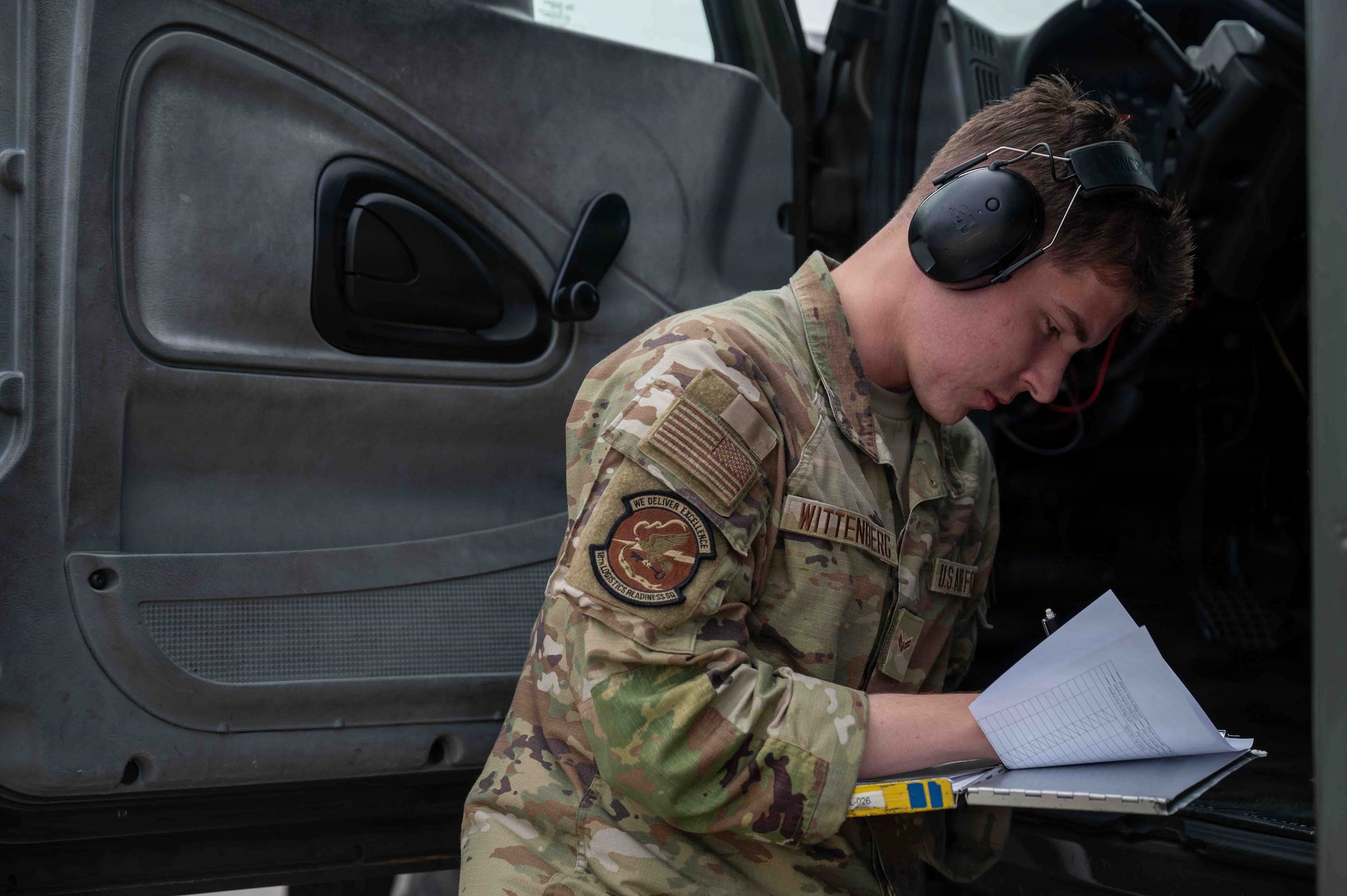 airman writting on a piece of paper for fuels.