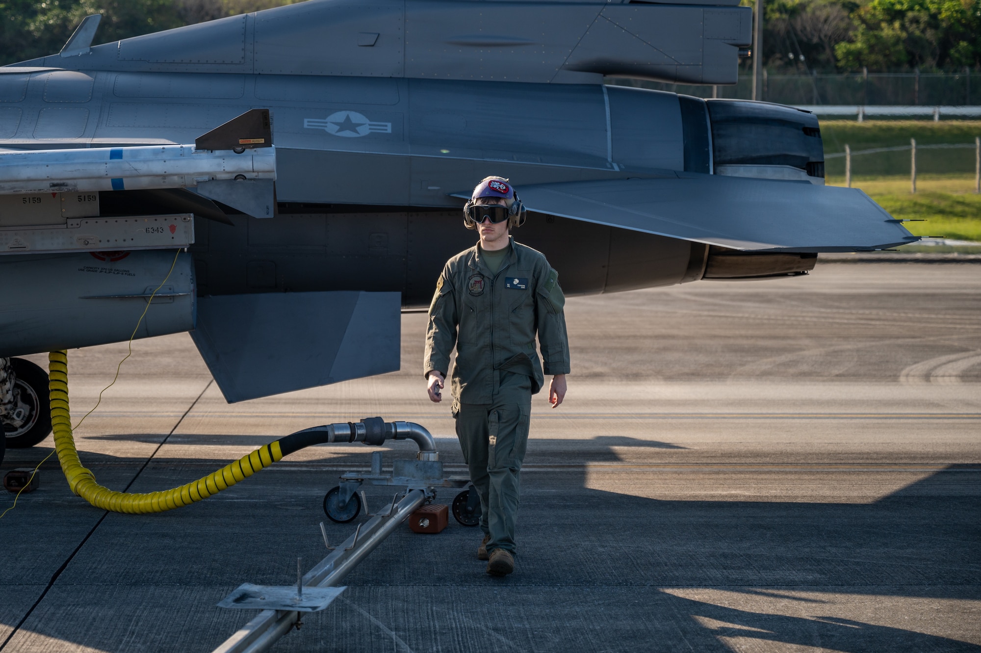 U.S. Marine Corps Cpl. Matthew Townsend, Headquarters and Headquarters Squadron expeditionary fuel technician, conducts hot pit refueling for a U.S. Air Force F-16C Fighting Falcon assigned to the 120th Expeditionary Fighter Squadron, deployed to Kadena Air Base, during a USAF-led operational exercise Beverly Midnight 26 at Marine Corps Air Station Futenma, Japan, March 11, 2026. BM26 reinforces the United States’ continued commitment to a free and open Indo-Pacific region. (U.S. Air Force photo by Airman 1st Class Francisco Huerta)