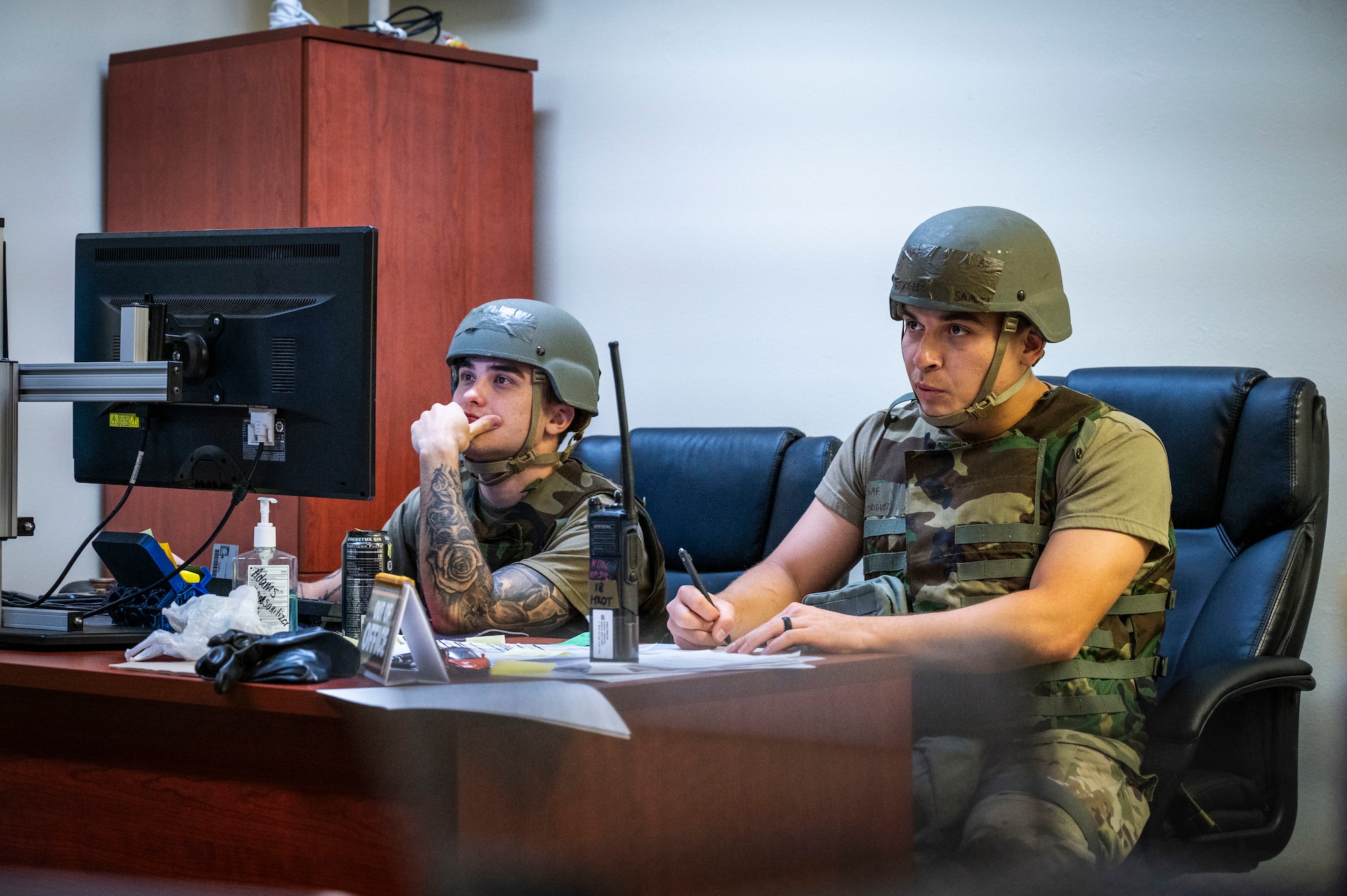 U.S. Air Force Senior Airman Riley Warren, left, 18th Maintenance Group weapons lead crew member, and Airman 1st Class Samuel Rodriguez, 18th Maintenance Operations Squadron maintenance manager, writes information into a medical report during a U.S. Air Force-led operational exercise Beverly Midnight 26 at Kadena Air Base, Japan, March 13, 2026. PACAF forces, alongside our Joint and multinational partners, routinely exercise and train at various locations, demonstrating our collective ability to deploy airpower throughout the Pacific. (U.S. Air Force photo by Senior Airman James Johnson)