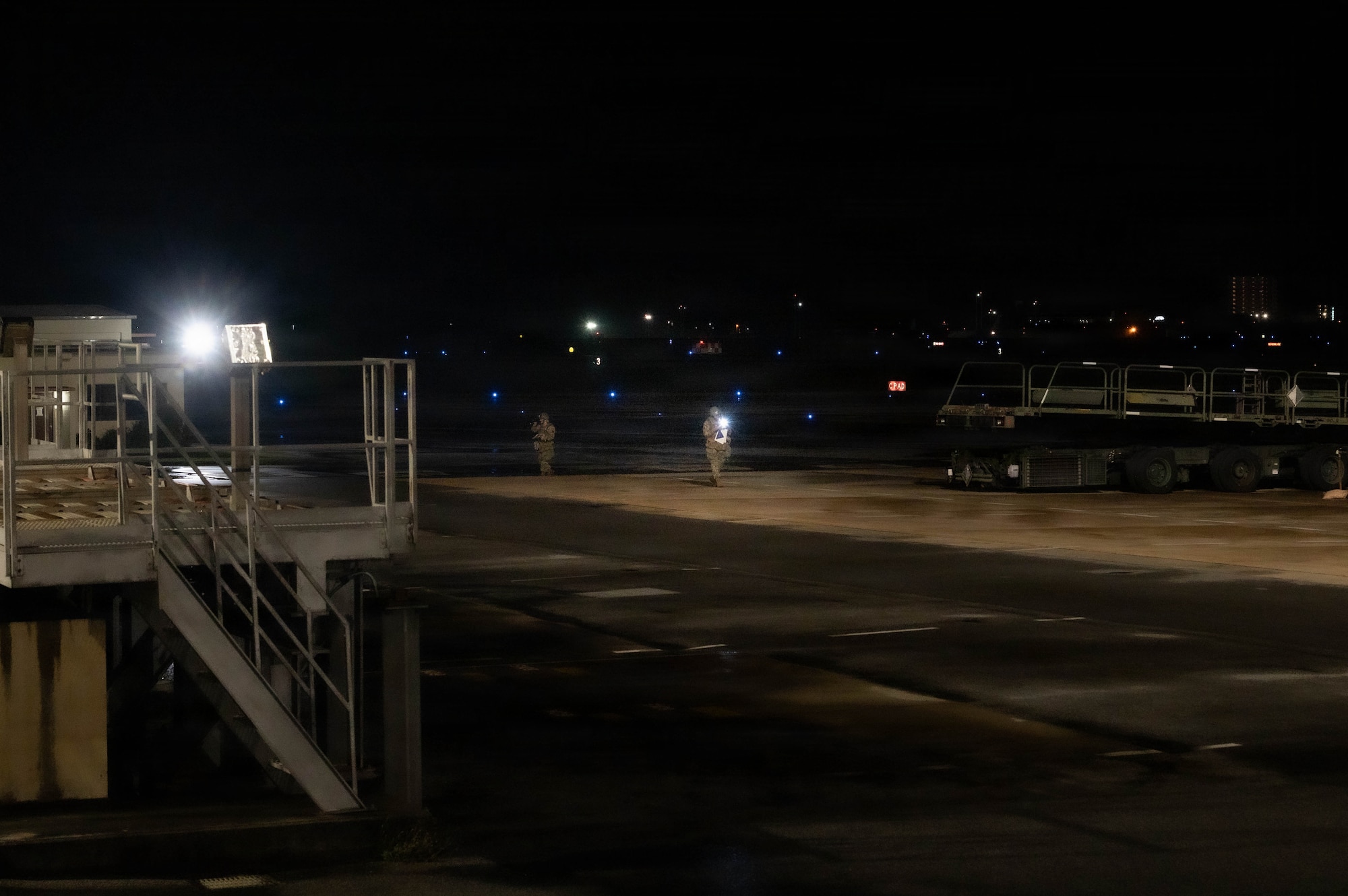 Airman simulating sweep after UXO.