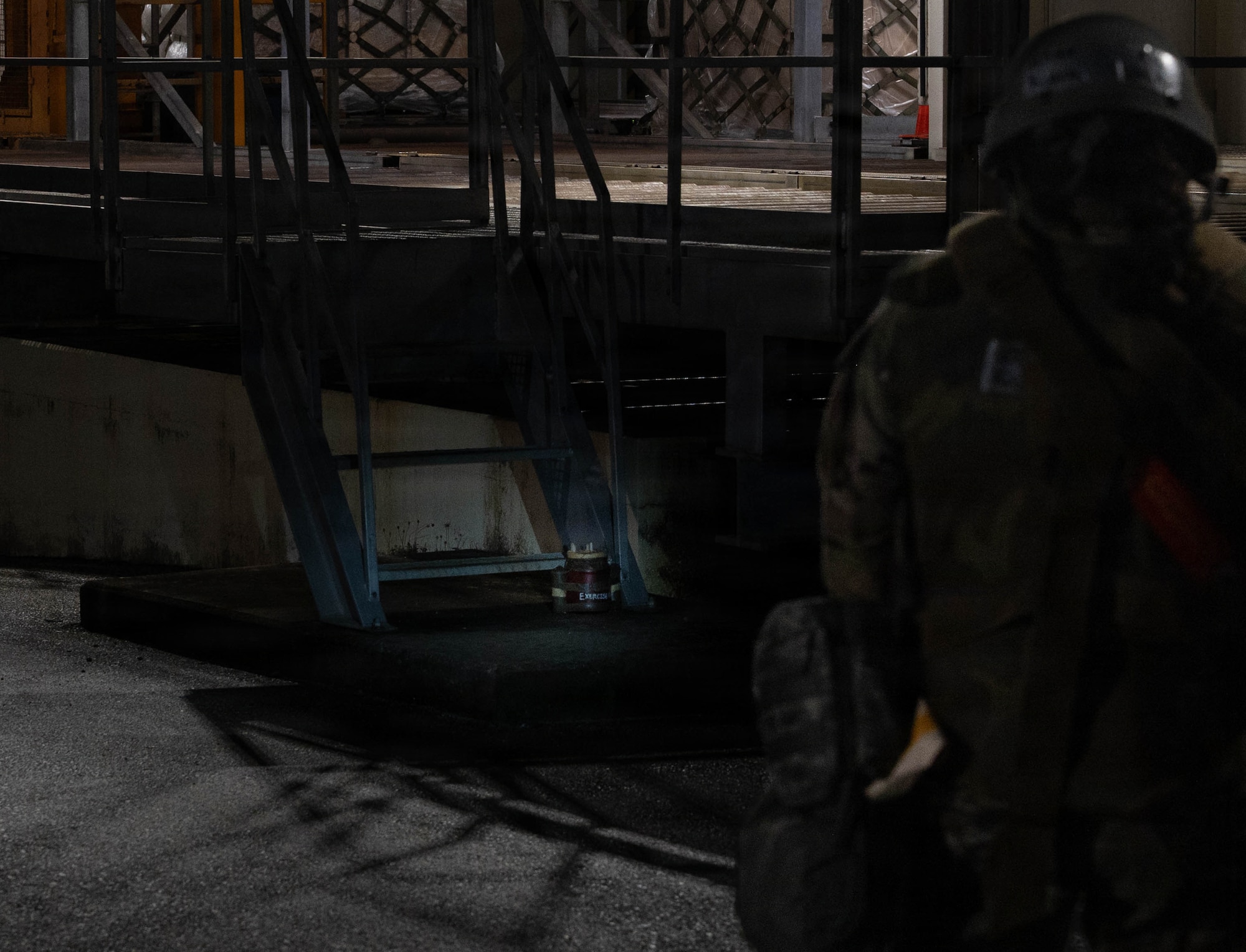 Airman simulating sweep after UXO.