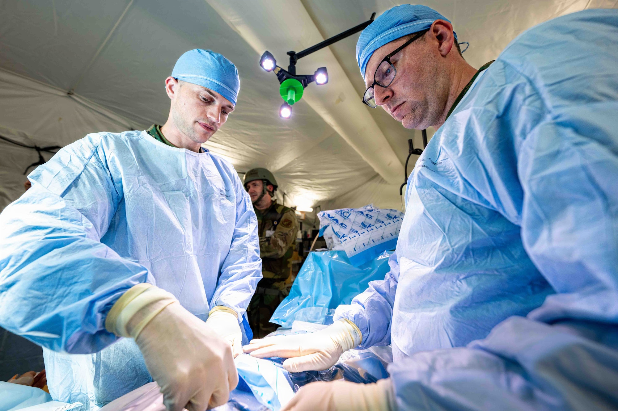 Service members  simulates treating abdominal injury