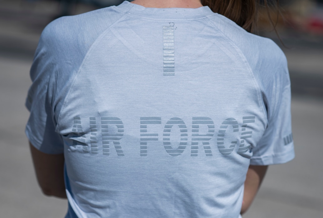 A person stands with the back of their shirt reading 'Air Force.'