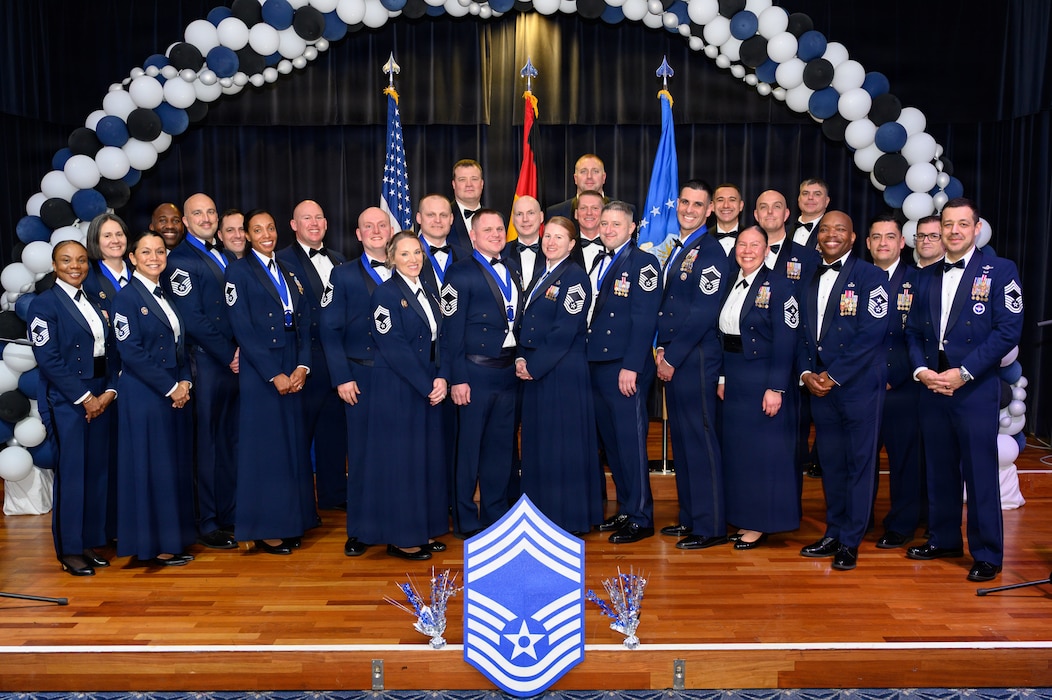 Chief Master Sergeants pose for a group photo during a ceremony.