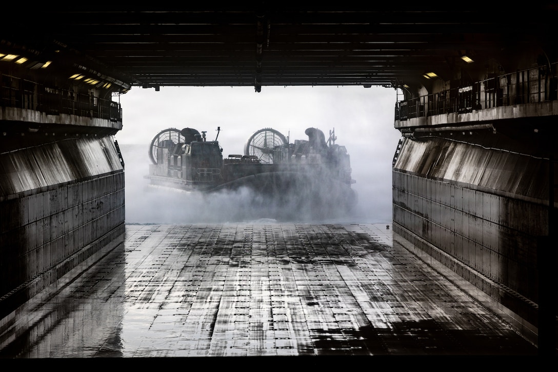 A U.S. Navy landing craft, air cushion departs from Wasp-class amphibious assault ship USS Iwo Jima (LHD 7), during landing craft, air cushion operations while underway in the Caribbean Sea, Mar. 7, 2026. U.S. military forces are deployed to the Caribbean in support of the U.S. Southern Command mission, Department of War-directed operations, and the president’s priorities to disrupt illicit drug trafficking and protect the homeland. (U.S. Marine Corps photo)