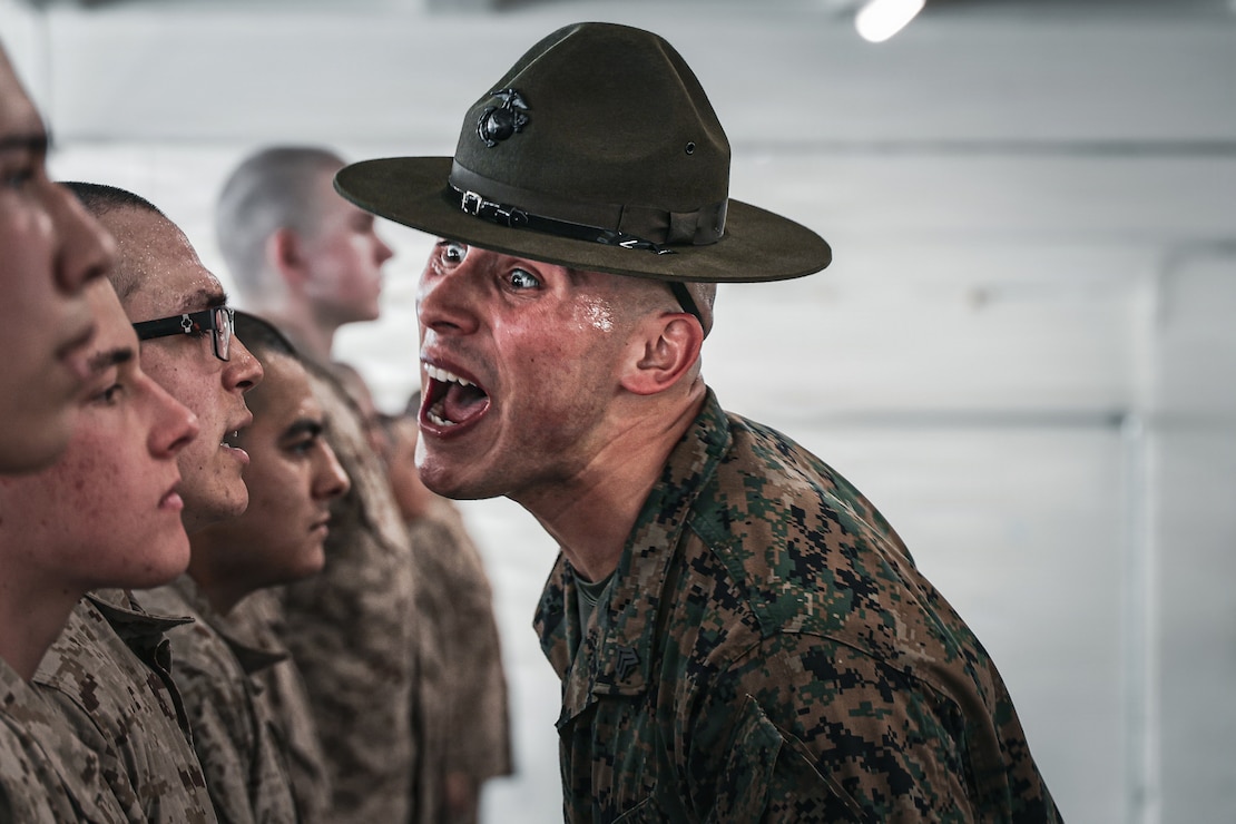U.S. Marine Corps Sgt. Jose Hinojosa, a drill instructor with Golf Company, 2nd Recruit Training Battalion, instructs a recruit during Pick-Up Day at Marine Corps Recruit Depot San Diego, California, Feb. 27, 2026.