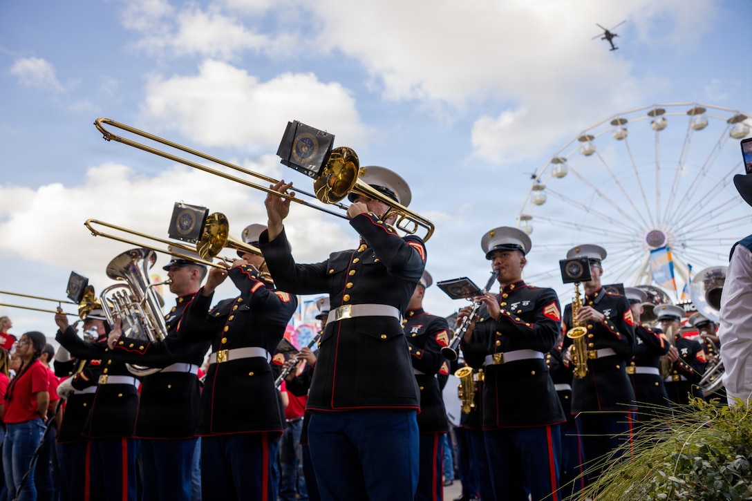 The U.S. Marine Forces Reserve Band performs at the Houston Livestock Show and Rodeo Armed Forces Appreciation Day prior to conducting an enlistment ceremony in Houston, March 4, 2026. Armed Forces Appreciation Day honored nearly 4,000 military personnel and veterans, including a joint service enlistment ceremony for approximately 500 recruits. (U.S. Marine Corps photo by SSgt. Ethan M. LeBlanc)