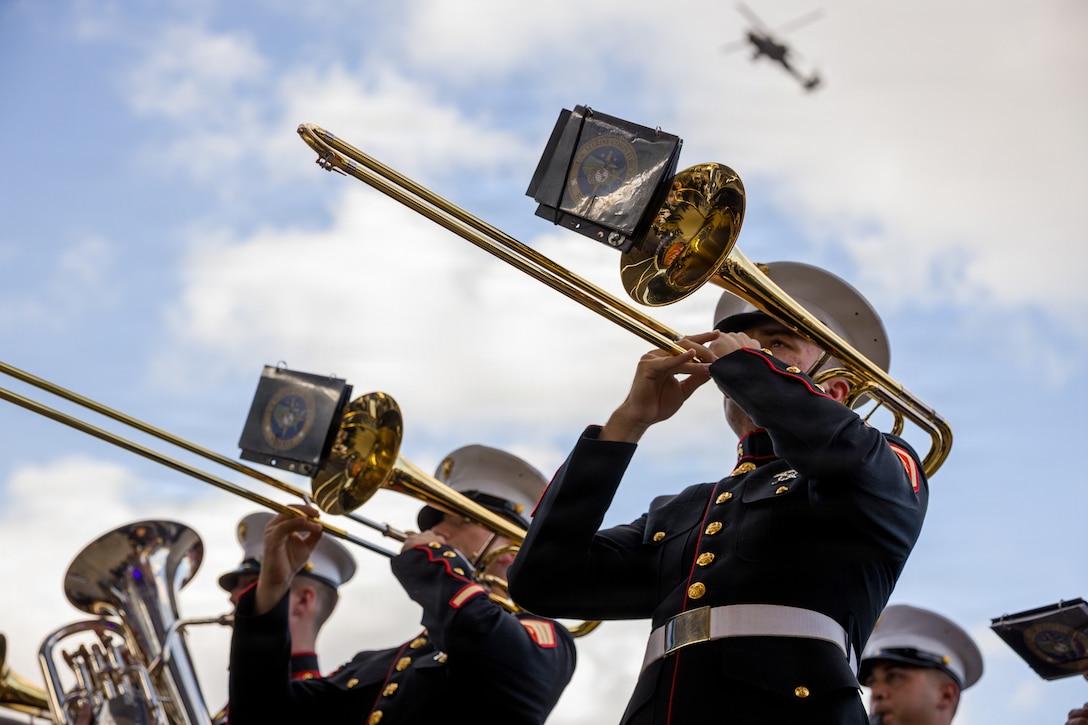 The U.S. Marine Forces Reserve Band performs at the Houston Livestock Show and Rodeo Armed Forces Appreciation Day prior to conducting an enlistment ceremony in Houston, March 4, 2026. Armed Forces Appreciation Day honored nearly 4,000 military personnel and veterans, including a joint service enlistment ceremony for approximately 500 recruits. (U.S. Marine Corps photo by SSgt. Ethan M. LeBlanc)