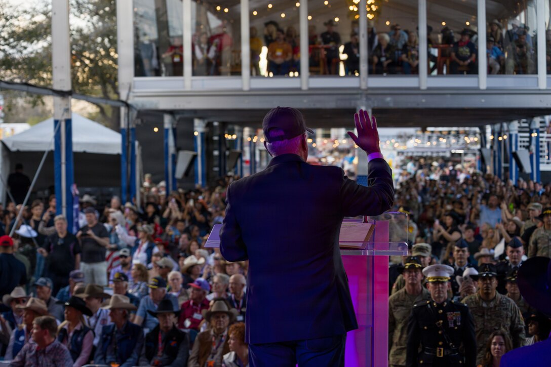 The Honorable Anthony J. Tata, Under Secretary of War for Personnel and Readiness, swears in approximately 500 new military recruits at the Houston Livestock Show and Rodeo Armed Forces Appreciation Day in Houston, March 4, 2026. Armed Forces Appreciation Day honored nearly 4,000 military personnel and veterans, including a joint service enlistment ceremony for new recruits. (U.S. Marine Corps photo by SSgt. Ethan M. LeBlanc)