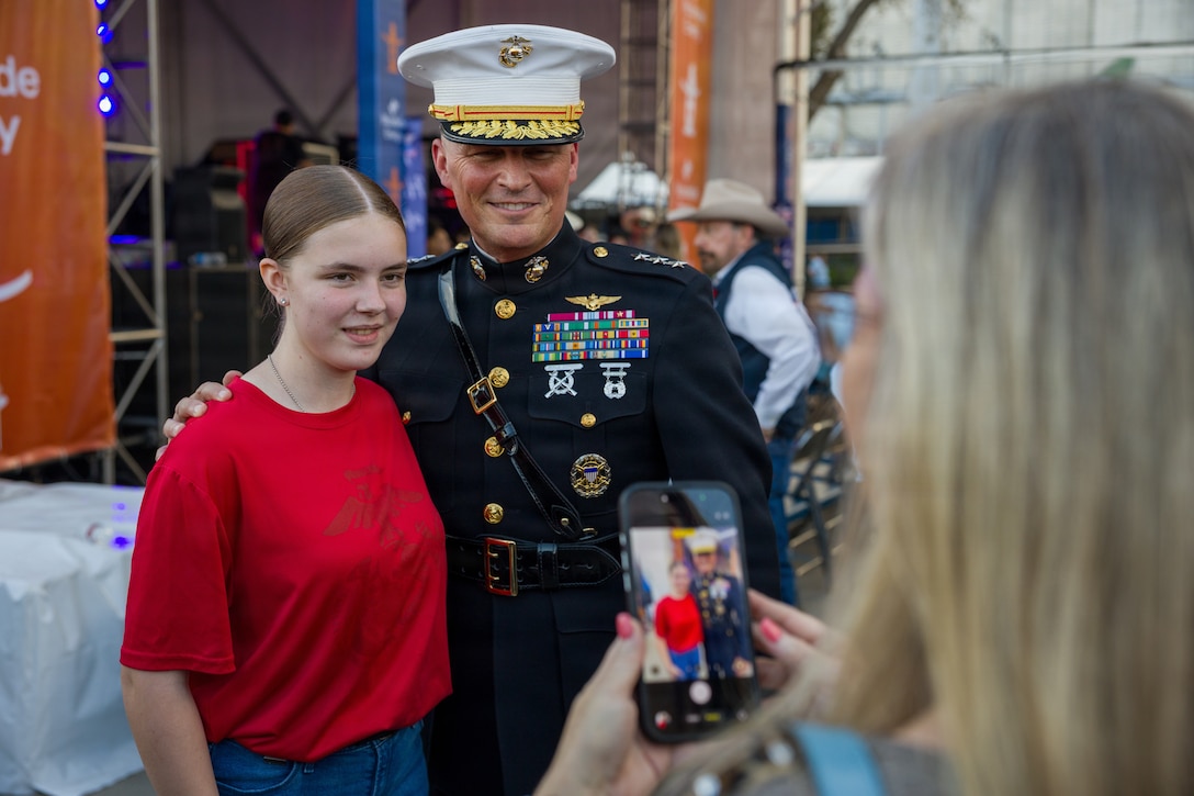 U.S. Marine Corps Lt. Gen. Leonard F. Anderson IV, commander of Marine Forces Reserve and Marine Forces South, takes a photo with a newly sworn-in Marine recruit at the Houston Livestock Show and Rodeo Armed Forces Appreciation Day in Houston, March 4, 2026. Armed Forces Appreciation Day honored nearly 4,000 military personnel and veterans, including a joint service enlistment ceremony for approximately 500 recruits. (U.S. Marine Corps photo by SSgt. Ethan M. LeBlanc)