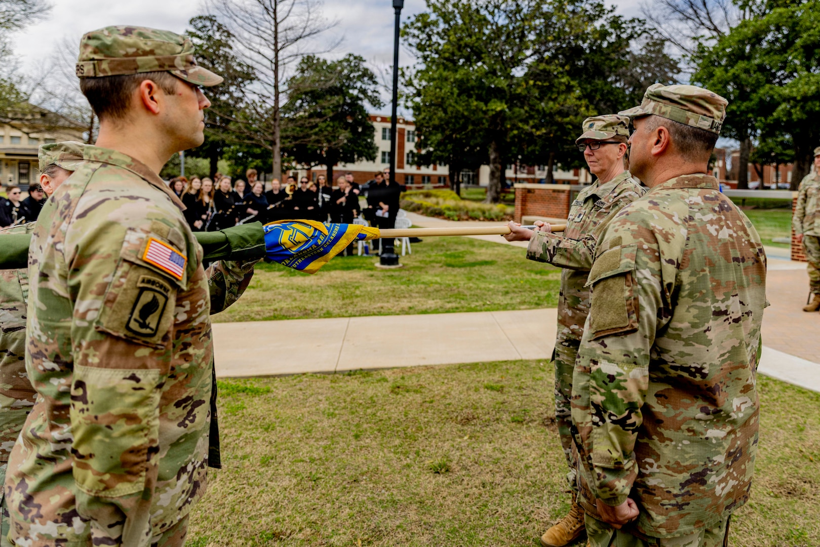 Lt. Col. Richelle Treece, commander of 2nd Battalion, 189th Regiment, Regional Training Institute, Oklahoma Army National Guard, uncases the guidon for the Southeastern Oklahoma State University’s Guard Officer Leadership Development (GOLD) program, March 11, 2026. The OKARNG’s GOLD program is designed to develop and prepare individuals for commissioned officer roles, equipping them with the skills needed to lead Soldiers effectively. Upon completion, candidates will attend Officer Candidate School. Once a candidate has completed the GOLD and OCS programs, they will become commissioned officers. (Oklahoma National Guard photo by Sgt. Haden Tolbert)