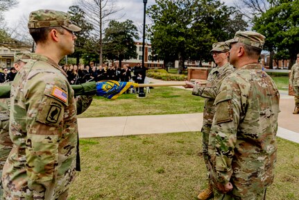 Lt. Col. Richelle Treece, commander of 2nd Battalion, 189th Regiment, Regional Training Institute, Oklahoma Army National Guard, uncases the guidon for the Southeastern Oklahoma State University’s Guard Officer Leadership Development (GOLD) program, March 11, 2026. The OKARNG’s GOLD program is designed to develop and prepare individuals for commissioned officer roles, equipping them with the skills needed to lead Soldiers effectively. Upon completion, candidates will attend Officer Candidate School. Once a candidate has completed the GOLD and OCS programs, they will become commissioned officers. (Oklahoma National Guard photo by Sgt. Haden Tolbert)