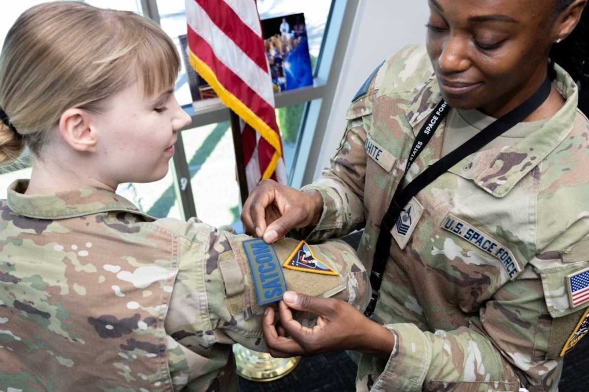 USSF MSgt. Terielle Wilhite, senior enlisted leader for System Delta 88 (Right) attaches the Delta’s mission ready certification patch to the uniform of USSF 1st Lt. Jennifer Leo, executive officer to System Delta 88 commander. Leo recently completed the Delta’s comprehensive training program designed to develop the acquisition skillset of its new personnel, providing them with the knowledge needed to make important programmatic decisions. (USSF photo by Chris Kim)