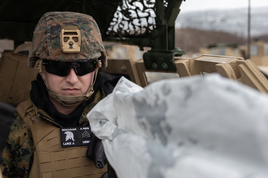 U.S. Marine Corps Sgt. Luke Kochvar, a military policeman with 4th Law Enforcement Battalion, Force Headquarters Group, Marine Forces Reserve, operates a Humvee turret in Elvegardsmoen, Norway, March 7, 2026. The military police convoy provided security for the movement of military equipment during exercise Cold Response 26. A key component of NATO's enhanced vigilance activity Arctic Sentry, exercise Cold Response 26 is a Norwegian-led winter military exercise designed to enhance collective defense capabilities and ensure U.S. readiness to rapidly deploy and seamlessly operate alongside NATO Allies in challenging arctic conditions. Kochvar is a native of Utah. (U.S. Marine Corps photo by Sgt. Emily De La Torre)