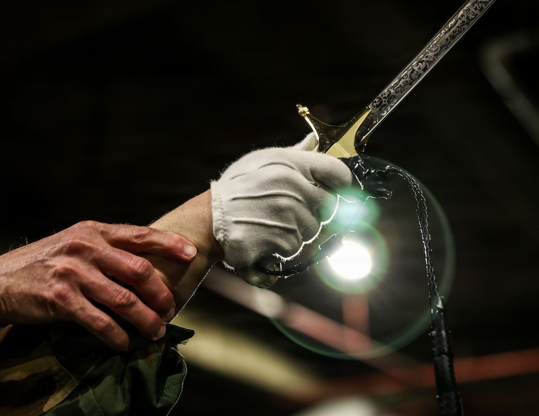 U.S. Marine Corps Capt. Lauri Schleicher, communication strategy and operations director, Headquarters & Service Company, conducts drill at Marine Barracks Washington, D.C., Feb. 18, 2026. The meticulous training ensures the Marines are prepared for the upcoming parade season, where they will perform for thousands of visitors. These movements are a hallmark of the precision and discipline expected of every Marine at the "Oldest Post of the Corps." (U.S. Marine Corps photo by Cpl. Brynn L. Bouchard)