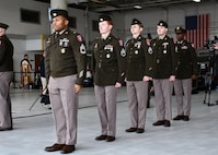 U.S. Army Soldiers from the Kansas City Recruiting Battalion stand in formation inside a downtown airport hangar, March 2, 2026, during a ceremony marking the arrival of the “Freedom Plane.” The Soldiers provided ceremonial support and assisted in safeguarding historic documents transported for museum display and secure storage.