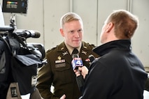 Lt. Col. Andrew Betson, commander of the U.S. Army Recruiting Battalion Kansas City, speaks with local media during the Freedom Plane ceremony at the downtown airport, March 2, 2026. The event marked the arrival of nationally significant historic artifacts and World War I-era documents that will be preserved and displayed at the National WWI Museum and Memorial in Kansas City.