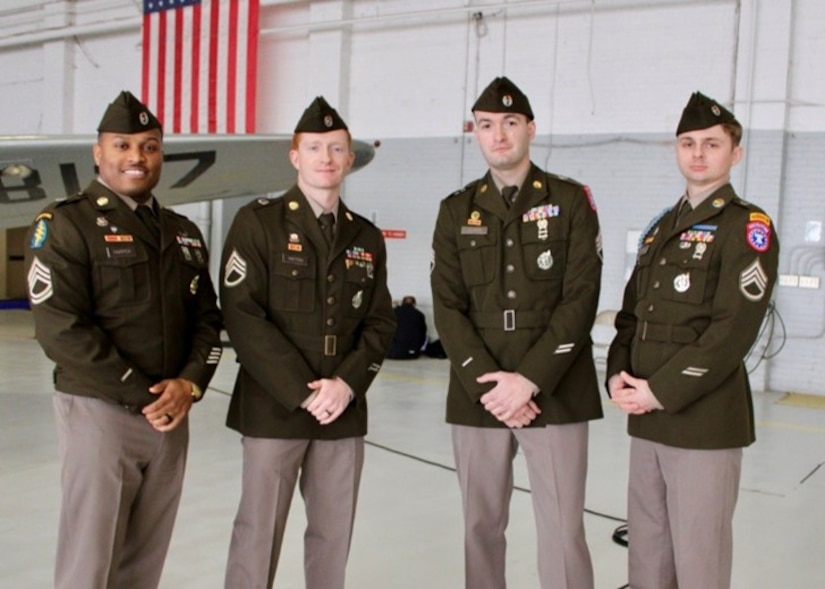 Soldiers assigned to the U.S. Army Recruiting Battalion Kansas City pose for a photo inside the hangar following the Freedom Plane ceremony at the downtown airport, March 2, 2026. The Soldiers participated in the arrival and secure transfer of historic artifacts and World War I-era documents that will be preserved and displayed at the National WWI Museum and Memorial in Kansas City.